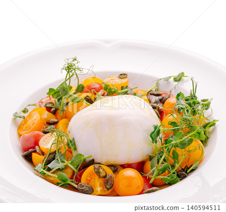 Fresh salad with burrata cheese and cherry tomatoes in a bowl 140594511