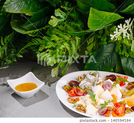 Gourmet Cheese Platter Served With Honey And Walnuts Gourmet Cheese Platter Served With Honey And Walnuts 140594584
