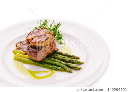 Fine dining dish with meat and asparagus served on white plate Fine dining dish with meat and asparagus served on white plate 140594591