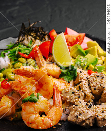 Delicious Seafood Poke Bowl With Shrimps And Avocado Delicious Seafood Poke Bowl With Shrimps And Avocado 140594608