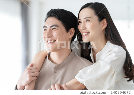 A middle-aged couple relaxing in the living room A middle-aged couple relaxing in the living room 140594672