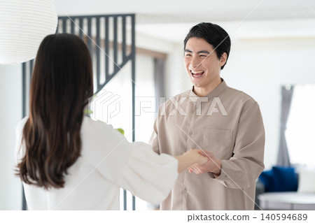 A middle-aged couple relaxing in the living room A middle-aged couple relaxing in the living room 140594689