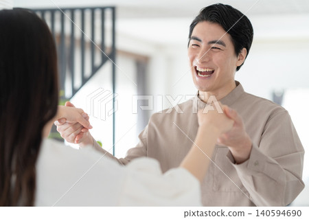 A middle-aged couple relaxing in the living room A middle-aged couple relaxing in the living room 140594690