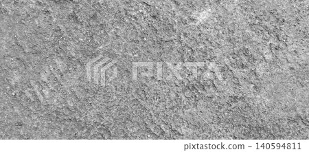 Close up of grey concrete surface texture with natural rough pattern and visible grain details. Close up of grey concrete surface texture with natural rough pattern and visible grain details. 140594811