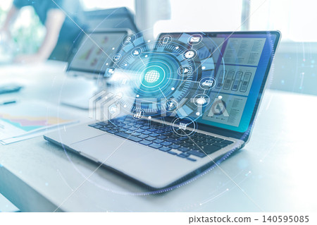 Using a laptop in a business meeting. Using a laptop in a business meeting. 140595085