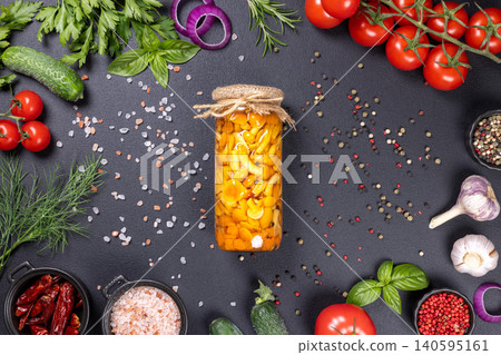 Preserving pickled mushrooms in jar with fresh ingredients 140595161
