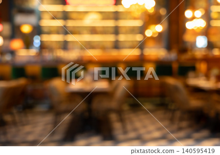 Blurred interior of a restaurant with warm bokeh lights abstract background Blurred interior of a restaurant with warm bokeh lights abstract background 140595419