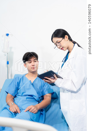 medicine, healthcare and people concept, doctor talking to male patient at bed in hospital. medicine, healthcare and people concept, doctor talking to male patient at bed in hospital. 140596079