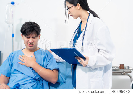 medicine, healthcare and people concept, doctor talking to male patient at bed in hospital. medicine, healthcare and people concept, doctor talking to male patient at bed in hospital. 140596080