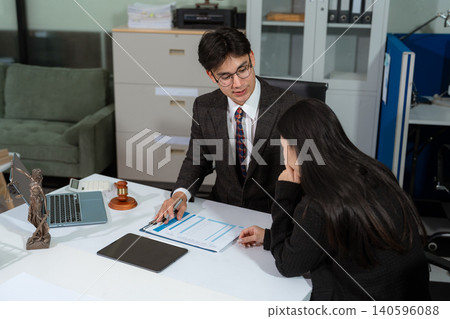 Lawyer comforts his clients with legal advice and serious stress trust commitment for justice issues and lawyer concepts. Lawyer comforts his clients with legal advice and serious stress trust commitment for justice issues and lawyer concepts. 140596088