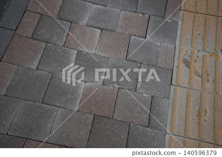 Tile-patterned sidewalk 140596379
