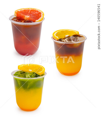 Layered iced coffee and matcha drinks with citrus 140596541