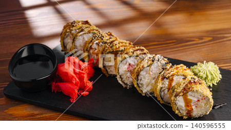 Fried tempura sushi rolls with ginger and wasabi Fried tempura sushi rolls with ginger and wasabi 140596555
