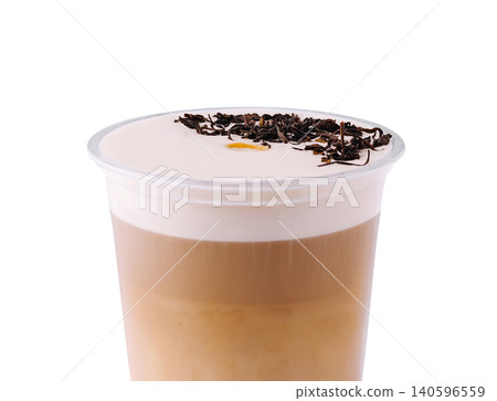 Cheese tea beverage with creamy foam and dry tea leaves 140596559
