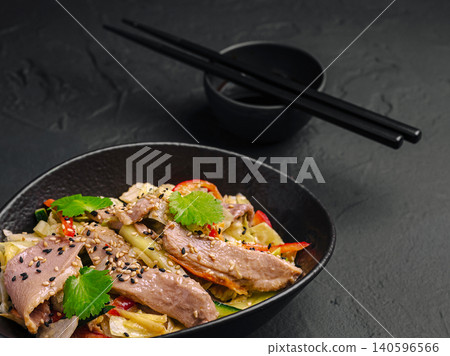Roasted duck salad with vegetables and sesame seeds Roasted duck salad with vegetables and sesame seeds 140596566