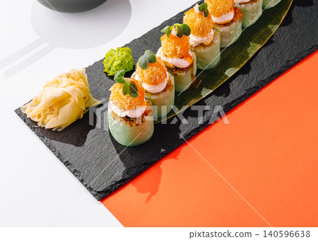 Gourmet sushi maki rolls serving on slate board 140596638