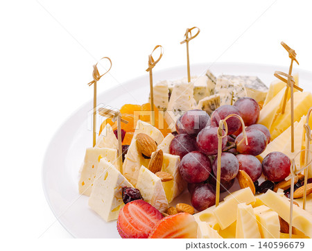 Cheese board platter serving assorted appetizer snacks Cheese board platter serving assorted appetizer snacks 140596679