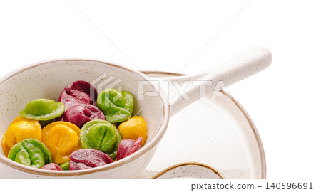 Colorful homemade pelmeni dumplings in speckle bowl Colorful homemade pelmeni dumplings in speckle bowl 140596691