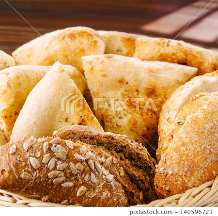 Fresh baked bread basket with various flour products 140596721