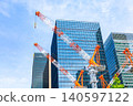 Large cranes and skyscrapers at a construction site 140597122