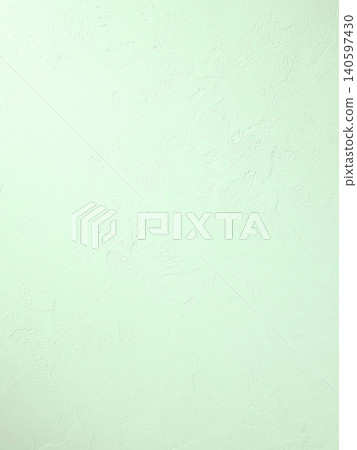 A vertical background image featuring a plaster wall with visible trowel marks, illuminated by bright, light green light. 140597430