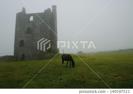 tmospheric misty moorland view with Cornish engine house. 140597521