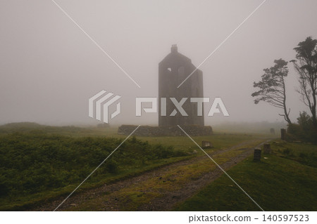 tmospheric misty moorland view with Cornish engine house. tmospheric misty moorland view with Cornish engine house. 140597523