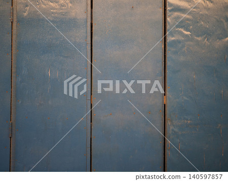 Blue metal panel background, worn industrial surface with rust detail Blue metal panel background, worn industrial surface with rust detail 140597857