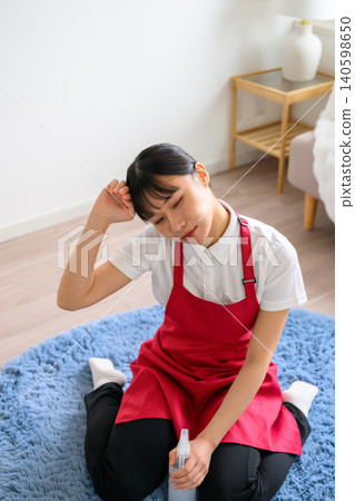 Exhausted from doing housework. Exhausted from doing housework. 140598650