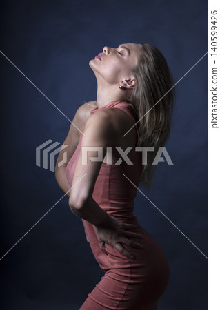 portrait of a young attractive woman on a dark background portrait of a young attractive woman on a dark background 140599426