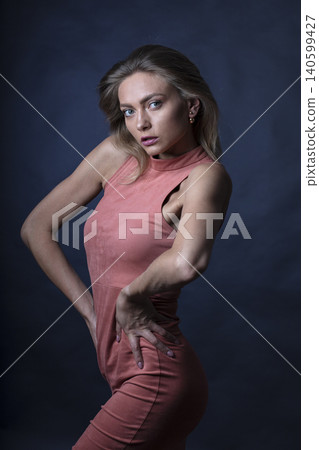 portrait of a young attractive woman on a dark background portrait of a young attractive woman on a dark background 140599427