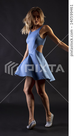 portrait of a young attractive woman on a dark background 140599461