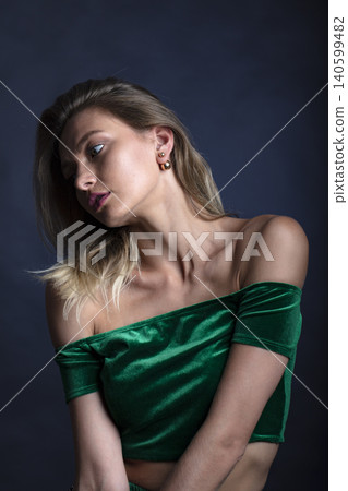 portrait of a young attractive woman on a dark background portrait of a young attractive woman on a dark background 140599482