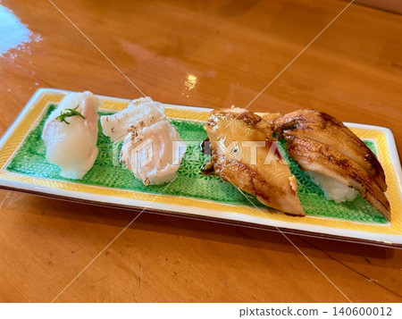 Nigiri sushi featuring raw or seared conger eel, a specialty of Tsushima Island in Nagasaki Prefecture. Nigiri sushi featuring raw or seared conger eel, a specialty of Tsushima Island in Nagasaki Prefecture. 140600012