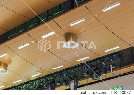 Professional stage lighting equipment hanging on a metal truss system in a modern theater Professional stage lighting equipment hanging on a metal truss system in a modern theater 140600087