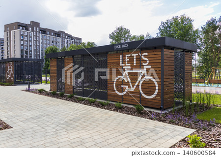 Modern wooden bike box storage facility in a contemporary residential neighborhood Modern wooden bike box storage facility in a contemporary residential neighborhood 140600584