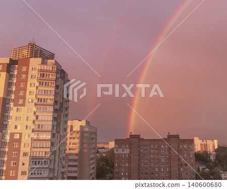 Colorful rainbow over residential high rise building during golden hour Colorful rainbow over residential high rise building during golden hour 140600680