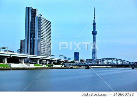 A long-exposure shot of Tokyo Skytree and the newly renovated Shirahige Bridge as seen from the Sumida River Terrace. A long-exposure shot of Tokyo Skytree and the newly renovated Shirahige Bridge as seen from the Sumida River Terrace. 140600788