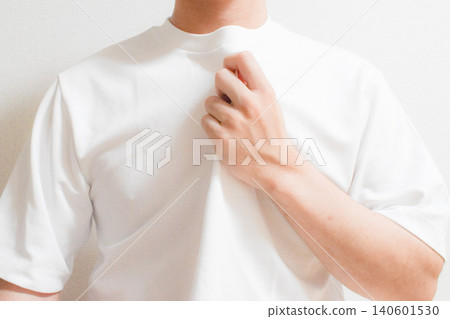 The image of fanning yourself with your clothes on a hot day. The image of fanning yourself with your clothes on a hot day. 140601530