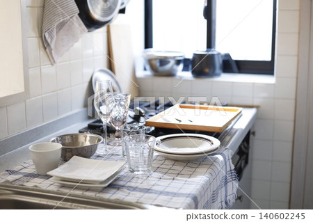 A kitchen lined with washed dishes. A kitchen lined with washed dishes. 140602245