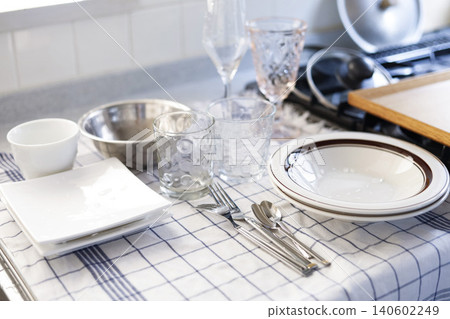 A kitchen lined with washed dishes. A kitchen lined with washed dishes. 140602249