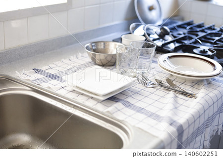 A kitchen lined with washed dishes. A kitchen lined with washed dishes. 140602251