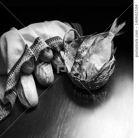 Bread and fish on the table Bread and fish on the table 140602584