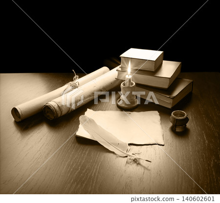 Books and candle on the table 140602601