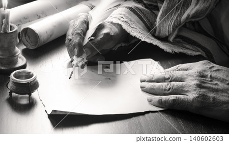 Male hand witn big quill Male hand witn big quill 140602603