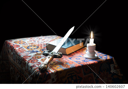 Iron sword on old bible 140602607