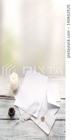 Envelope and paper on white wooden table Envelope and paper on white wooden table 140602626