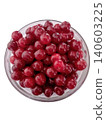 A bowl of red cherries sits on a white background The cherries are ripe and ready to eat 140603225