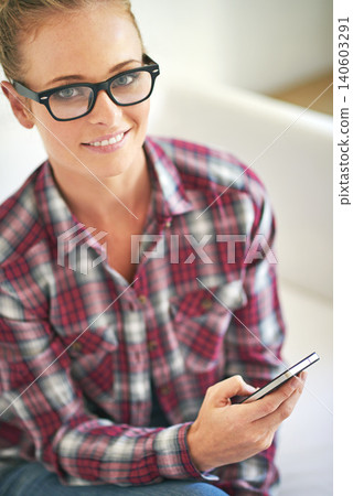 Woman, portrait and online with phone in home for communication, social media or mobile chat with smile. Person, face and happy with smartphone for text message, internet scroll or email with glasses Woman, portrait and online with phone in home for communication, social media or mobile chat with smile. Person, face and happy with smartphone for text message, internet scroll or email with glasses 140603291