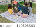 Children Celebrating a Dog's Birthday Picnic in the Park 140603303